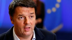 Italy's Prime Minister Matteo Renzi talks to the media as he leaves a European Union leaders summit in Brussels, Belgium,