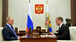 Russian President Vladimir Putin (L) meets with Prime Minister Dmitry Medvedev at the Novo-Ogaryovo state residence outside Moscow, Russia