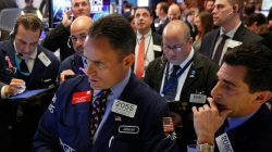 Traders work on the floor of the New York Stock Exchange (NYSE)