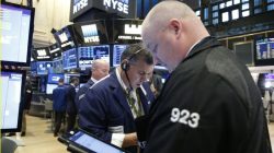 Traders work on the floor of the New York Stock Exchange