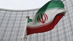 An Iranian flag flutters in front of the International Atomic Energy Agency (IAEA) headquarters in Vienna, Austria,