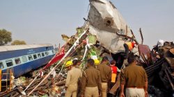 Rescue workers search for survivors at the site of a train derailment in Pukhrayan, south of Kanpur city, India