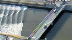 A tidal surge is seen in Sunaoshi River after tsunami advisories were issued following an earthquake in Tagajo, Miyagi prefecture, Japan November 22, 2016, in this video grab image released by Miyagi Prefectural Police via Kyodo. Mandatory credit