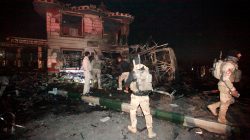 Iraqi security forces gather at the site of a suicide truck bomb attack, at a petrol station in the city of Hilla south of Baghdad, Iraq, November 24,