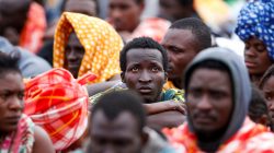 Migrants disembark from a vessel of ONG Medecins sans Frontieres (MSF) in the Sicilian harbour of Augusta, Italy, June 24
