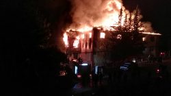 Firemen try to extinguish flames rising from a fire in a school dormitory in Aladag, in the southern city of Adana, Turkey