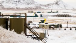 Pumpjacks and other infrastructure for producing oil dot fields outside of Watford City, North Dakota,