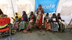 Nigerian Women and Children waiting at a nutrition clinic