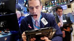 Traders work on the floor of the New York Stock Exchange (NYSE) in New York City, U.S.,