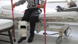 Rachid Jassam, 15, who nearly had his leg amputated after he was injured by an airstrike outside his house in Falluja, Iraq, sits on a hospital bed inside a Medecins Sans Frontieres hospital in Amman, Jordan