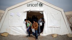 Displaced Iraqi boys leave a tent school set by United Nations Children's Fund (UNICEF) at Hassan Sham camp, east of Mosul, Iraq