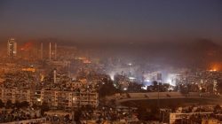 Smoke and flames rise after air strikes on rebel-controlled besieged area of Aleppo, as seen from a government-held side, in