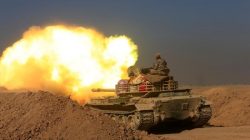 Members of the Iraqi Army fire towards Islamic State militant positions at the south of Mosul, Iraq.