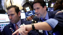 Traders work on the floor of the New York Stock Exchange (NYSE) in New York City, U.S.,