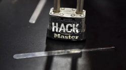 Padlock with the word hack, a representation of cyber attacks