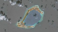 A satellite image shows what CSIS Asia Maritime Transparency Initiative says appears to be anti-aircraft guns and what are likely to be close-in weapons systems (CIWS) on the artificial island Subi Reef in the South China Sea in this image released on December