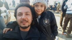 A still image taken on December 19, 2016 from a handout video posted by IHH, shows a still photograph of Syrian girl who tweeted from Aleppo, Bana Alabed, posing with IHH aid worker Burak Karacaoglu in al-Rashideen, Syria.