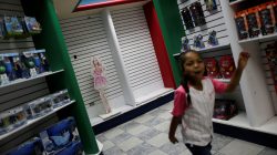 A child walks in a toy store in Caracas, Venezuela, December 1, 2016.