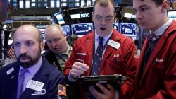 Traders work on the floor of the New York Stock Exchange (NYSE) in New York City, U.S.,