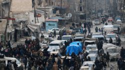 Rebel fighters and civilians wait to be evacuated from a rebel-held sector of eastern Aleppo, Syria December 18, 2016.