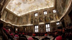 Pope Francis (L) speaks during the traditional greetings to the Roman Curia in the Sala Clementina (Clementine Hall) of the Apostolic Palace, at the Vatican