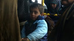 Evacuees from the Shi'ite Muslim villages of al-Foua and Kefraya ride a bus at insurgent-held al-Rashideen in Aleppo province, Syria