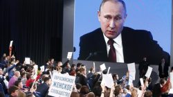 Journalists listen to Russian President Vladimir Putin during his annual end-of-year news conference in Moscow, Russia, December 23,