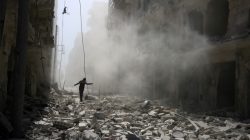 SYRIA: A man walks on the rubble of damaged buildings after an airstrike on the rebel held al-Qaterji neighbourhood of Aleppo, Syria