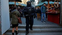 A member of the New York Police Department's Counterterrorism Bureau patrols the Union Square Holiday market following the Berlin Christmas market attacks in Manhattan, New York City