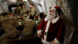 U.S. soldiers enjoy a Christmas dinner at an army base in Karamless town, east of Mosul,