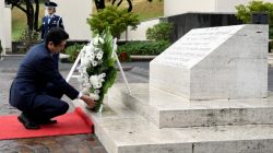 Japan's Prime Minister Shinzo Abe presents a wreath at the National Memorial Cemetery of the Pacific at Punchbowl in Honolulu, Hawaii, U.S.