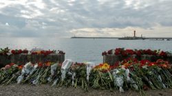 Flowers in memory of passengers and crew members of Russian military Tu-154, which crashed into the Black Sea on its way to Syria on Sunday, are placed at an embankment in the Black Sea resort city of Sochi, Russia