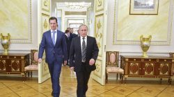 Russian President Vladimir Putin (R) and Syrian President Bashar al-Assad enter a hall during a meeting at the Kremlin in Moscow, Russia