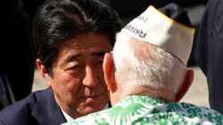 Japanese Prime Minister Shinzo Abe speaks with a Pearl Harbor survivor after he and U.S. President Barack Obama spoke at Joint Base Pearl Harbor-Hickam, Hawaii, U.S., December 27, 2016..