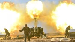Members of Hashid Shaabi or Popular Mobilization Forces (PMF) fire towards Islamic State militant positions in west of Mosul, Iraq