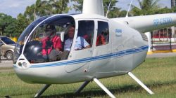 File photo - Then-local mayor of Davao city Rodrigo Duterte (R), aboard a helicopter, arrives at the provincial capitol in Tagum city, Davao del Norte, southern Philippines for the Regional Peace and Order Council meeting,