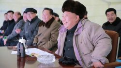 North Korea leader Kim Jong Un watching missile test