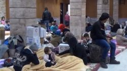Civilians rescued from enemy fire in Damascus shelter short on supplies