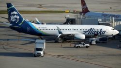 Workers prepare airplanes on the tarmac at Ft. Lauderdale International Airport after it re-opened following a mass shooting in Ft. Lauderdale, Florida