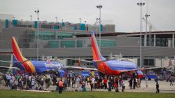 People on the airport ramp area near terminals 1 and 2 are seen following a shooting incident at Fort Lauderdale-Hollywood International Airport in Florida,