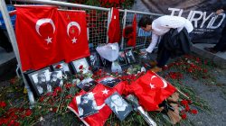 A man places flowers at the entrance of Reina nightclub, which was attacked by a gunman, in Istanbul, Turkey January 3, 2017.