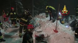 italian firefighters working to rescue people from avalanche