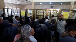 public workers crowd post office to receive salaries