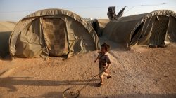 displace Syrian boy in refugee camp