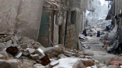 People work to clean damaged Aleppo