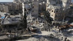 people see debris of attack in Syria