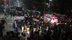 Police and rescue workers work at the scene of a blast in Lahore, Pakista