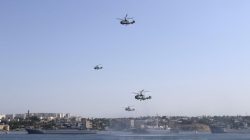 Russian military helicopters fly in formation
