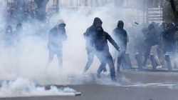 Clouds of tear gas surround youths as they face off with French police during a demonstration against police brutality after a young black man, 22-year-old youth worker named Theo, was severely injured during his arrest earlier this month, in Paris, France, February 23, 2017. REUTERS/Gonzalo Fuentes