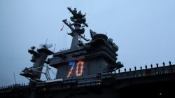 Sailors man the rails as the USS Carl Vinson aircraft carrier departs on deployment from Naval Station North Island in Coronado, California, U.S. January 5, 2017. REUTERS/Mike Blake